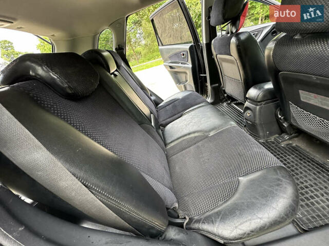 Черный Хендай Туксон, объемом двигателя 2 л и пробегом 210 тыс. км за 6600 $, фото 65 на Automoto.ua
