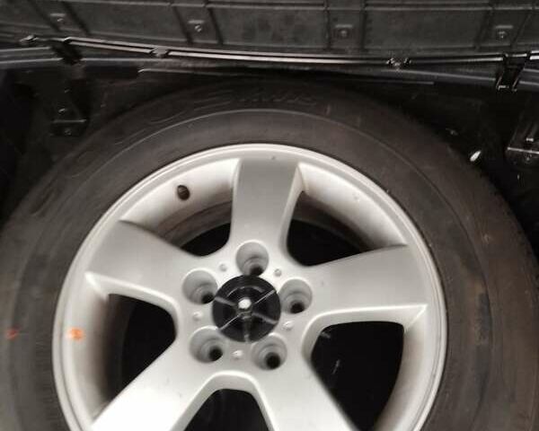 Черный Хендай Туксон, объемом двигателя 1.99 л и пробегом 250 тыс. км за 6650 $, фото 4 на Automoto.ua