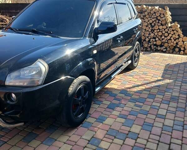 Черный Хендай Туксон, объемом двигателя 2 л и пробегом 315 тыс. км за 7000 $, фото 14 на Automoto.ua