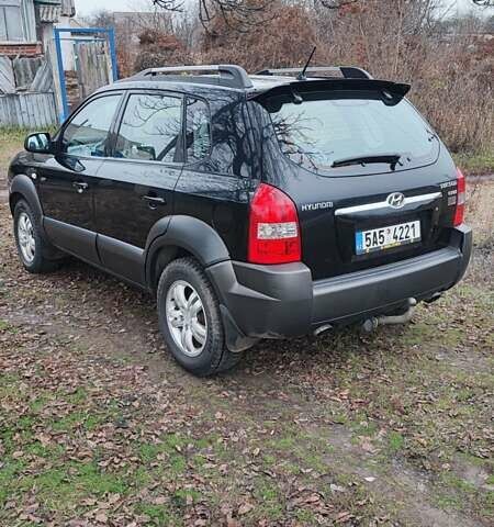 Черный Хендай Туксон, объемом двигателя 2 л и пробегом 284 тыс. км за 4700 $, фото 4 на Automoto.ua