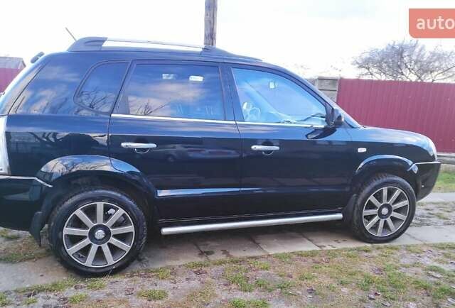 Черный Хендай Туксон, объемом двигателя 2 л и пробегом 208 тыс. км за 6950 $, фото 55 на Automoto.ua