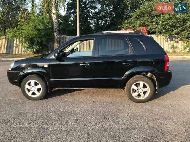 Черный Хендай Туксон, объемом двигателя 2 л и пробегом 253 тыс. км за 7500 $, фото 6 на Automoto.ua