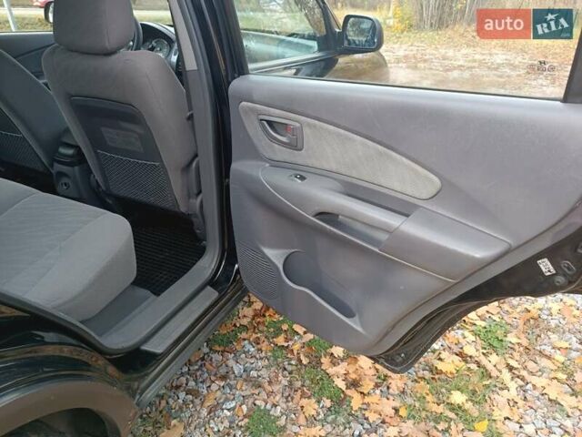 Черный Хендай Туксон, объемом двигателя 1.98 л и пробегом 192 тыс. км за 6900 $, фото 14 на Automoto.ua