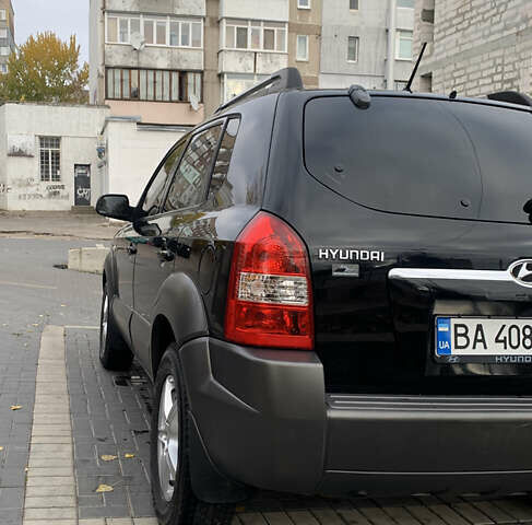 Черный Хендай Туксон, объемом двигателя 2 л и пробегом 219 тыс. км за 8400 $, фото 4 на Automoto.ua