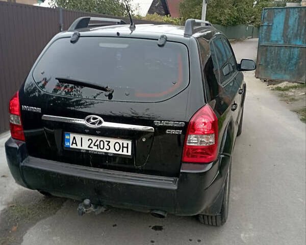 Черный Хендай Туксон, объемом двигателя 2 л и пробегом 261 тыс. км за 7500 $, фото 2 на Automoto.ua
