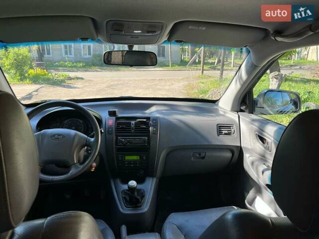 Черный Хендай Туксон, объемом двигателя 2 л и пробегом 232 тыс. км за 6900 $, фото 9 на Automoto.ua