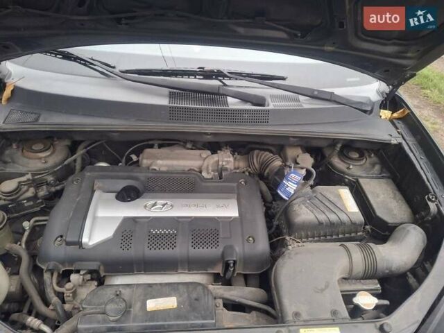 Черный Хендай Туксон, объемом двигателя 2 л и пробегом 224 тыс. км за 6800 $, фото 5 на Automoto.ua
