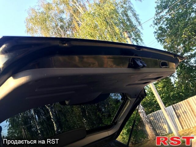 Черный Хендай Туксон, объемом двигателя 2 л и пробегом 253 тыс. км за 7600 $, фото 1 на Automoto.ua