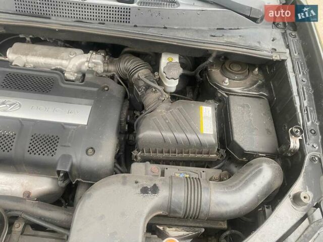 Черный Хендай Туксон, объемом двигателя 2 л и пробегом 190 тыс. км за 7500 $, фото 18 на Automoto.ua