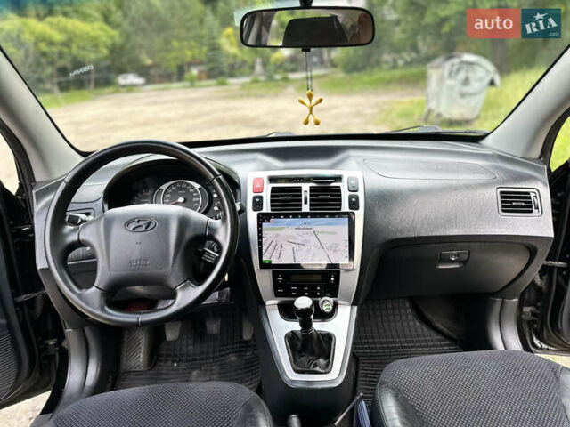 Черный Хендай Туксон, объемом двигателя 2 л и пробегом 210 тыс. км за 6600 $, фото 53 на Automoto.ua