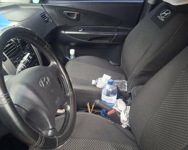 Черный Хендай Туксон, объемом двигателя 2 л и пробегом 224 тыс. км за 6800 $, фото 8 на Automoto.ua