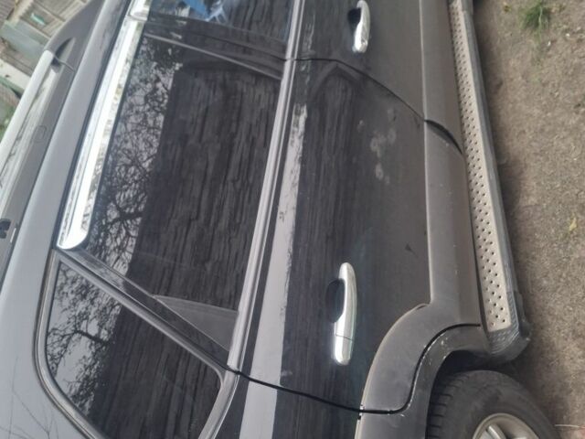 Черный Хендай Туксон, объемом двигателя 2 л и пробегом 224 тыс. км за 6800 $, фото 10 на Automoto.ua