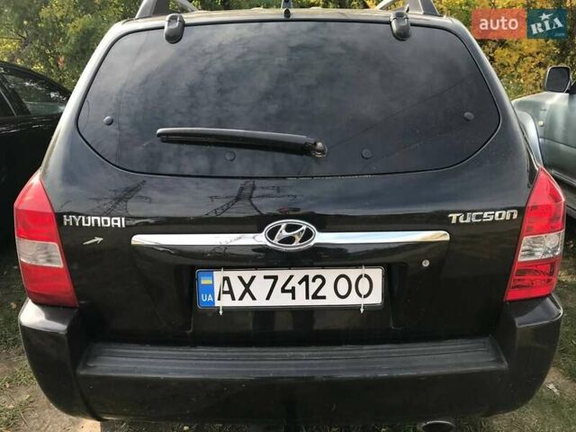 Черный Хендай Туксон, объемом двигателя 2 л и пробегом 253 тыс. км за 7500 $, фото 1 на Automoto.ua