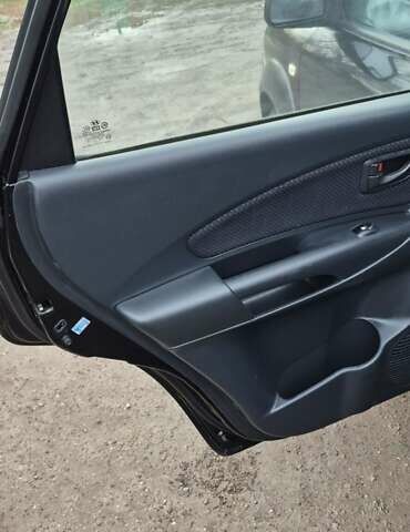 Черный Хендай Туксон, объемом двигателя 1.98 л и пробегом 230 тыс. км за 6390 $, фото 14 на Automoto.ua