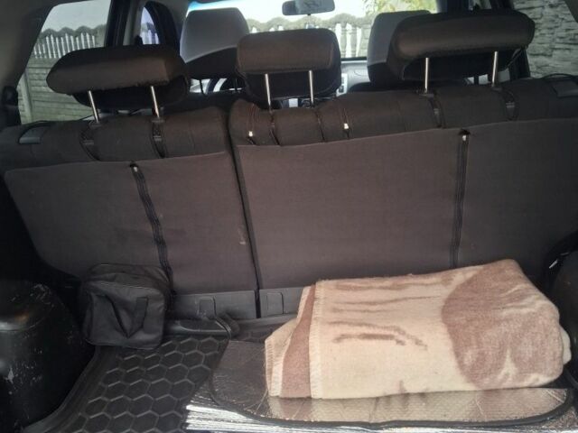 Черный Хендай Туксон, объемом двигателя 2 л и пробегом 224 тыс. км за 6800 $, фото 8 на Automoto.ua