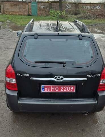 Черный Хендай Туксон, объемом двигателя 1.98 л и пробегом 230 тыс. км за 6390 $, фото 7 на Automoto.ua