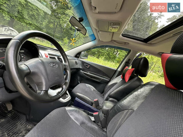Черный Хендай Туксон, объемом двигателя 2 л и пробегом 210 тыс. км за 6600 $, фото 40 на Automoto.ua