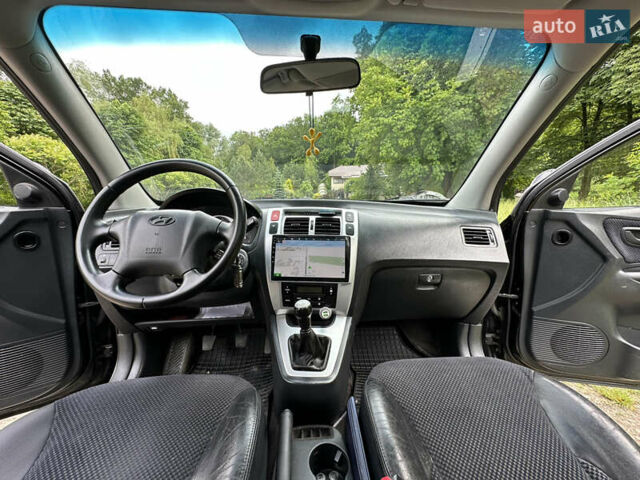 Черный Хендай Туксон, объемом двигателя 2 л и пробегом 210 тыс. км за 6600 $, фото 59 на Automoto.ua