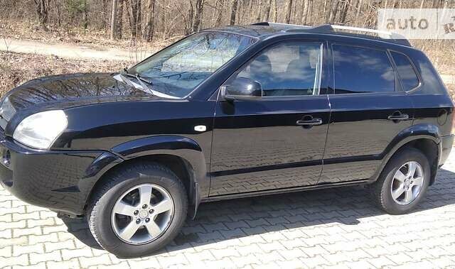 Черный Хендай Туксон, объемом двигателя 2 л и пробегом 210 тыс. км за 7000 $, фото 11 на Automoto.ua