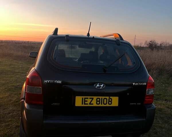 Черный Хендай Туксон, объемом двигателя 1.98 л и пробегом 135 тыс. км за 3950 $, фото 9 на Automoto.ua