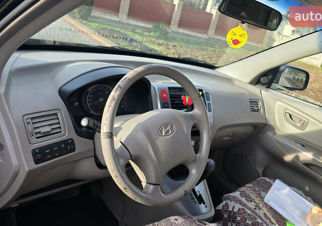 Черный Хендай Туксон, объемом двигателя 2 л и пробегом 217 тыс. км за 7552 $, фото 7 на Automoto.ua