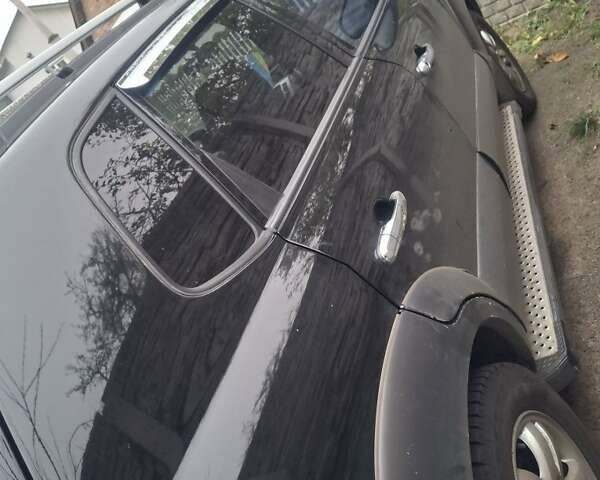 Черный Хендай Туксон, объемом двигателя 2 л и пробегом 224 тыс. км за 6800 $, фото 10 на Automoto.ua