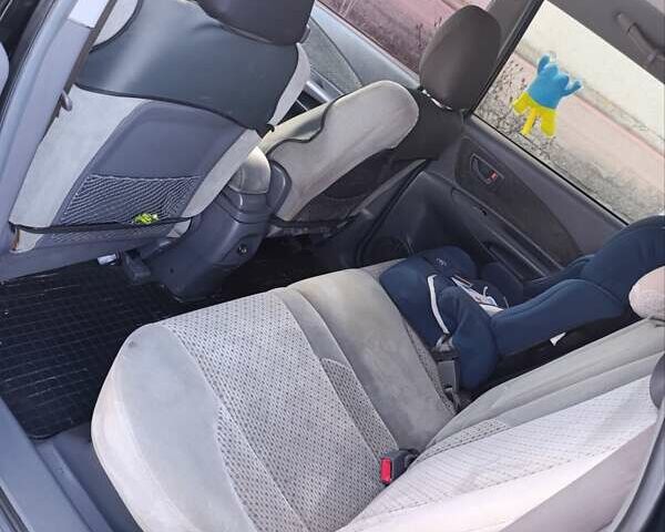 Черный Хендай Туксон, объемом двигателя 1.98 л и пробегом 285 тыс. км за 5600 $, фото 6 на Automoto.ua