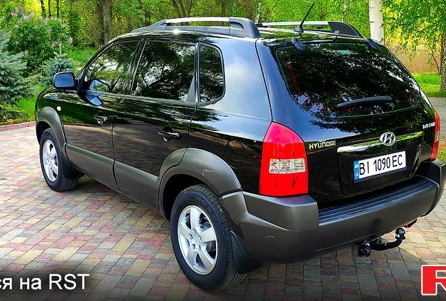 Чорний Хендай Туксон, об'ємом двигуна 2 л та пробігом 240 тис. км за 7400 $, фото 1 на Automoto.ua