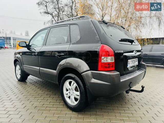 Черный Хендай Туксон, объемом двигателя 1.98 л и пробегом 252 тыс. км за 7300 $, фото 6 на Automoto.ua