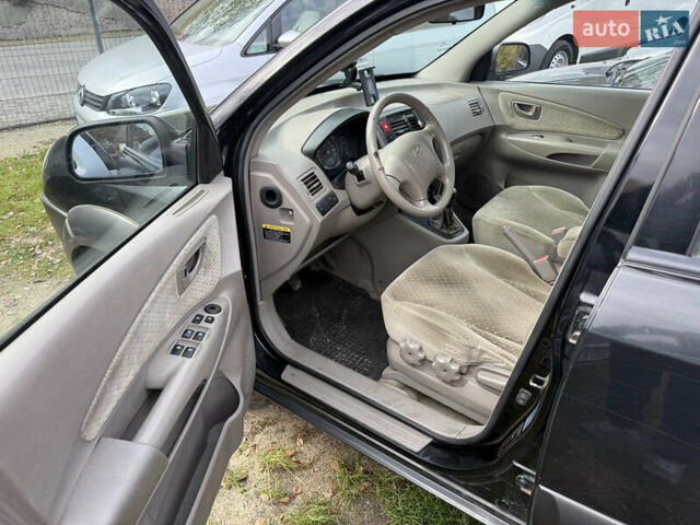 Черный Хендай Туксон, объемом двигателя 2 л и пробегом 211 тыс. км за 4444 $, фото 7 на Automoto.ua