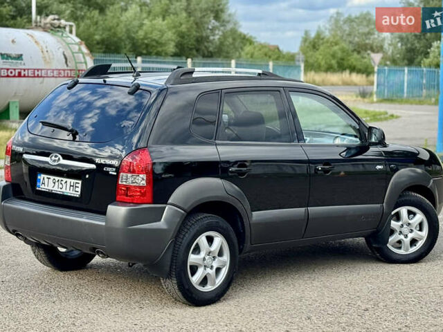 Черный Хендай Туксон, объемом двигателя 2 л и пробегом 225 тыс. км за 7900 $, фото 12 на Automoto.ua