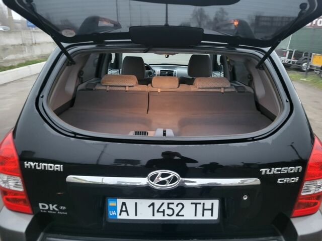 Черный Хендай Туксон, объемом двигателя 2 л и пробегом 180 тыс. км за 4500 $, фото 5 на Automoto.ua