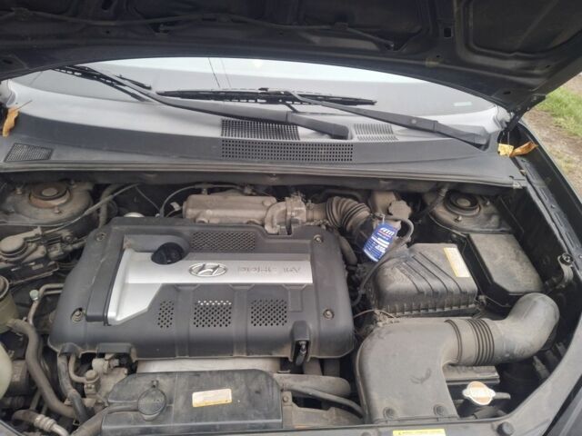 Черный Хендай Туксон, объемом двигателя 2 л и пробегом 224 тыс. км за 6800 $, фото 6 на Automoto.ua