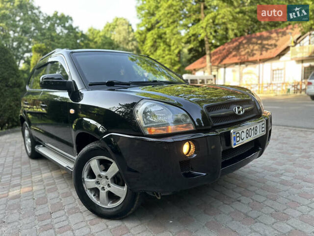 Черный Хендай Туксон, объемом двигателя 2 л и пробегом 210 тыс. км за 6600 $, фото 3 на Automoto.ua