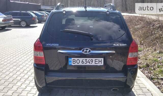 Черный Хендай Туксон, объемом двигателя 2 л и пробегом 210 тыс. км за 7000 $, фото 9 на Automoto.ua