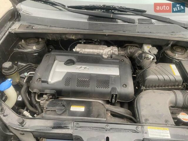 Черный Хендай Туксон, объемом двигателя 2 л и пробегом 190 тыс. км за 7500 $, фото 11 на Automoto.ua