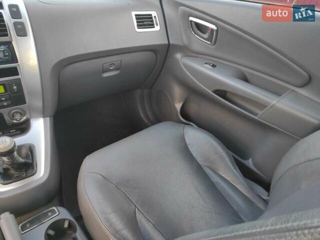 Черный Хендай Туксон, объемом двигателя 2 л и пробегом 208 тыс. км за 6950 $, фото 23 на Automoto.ua