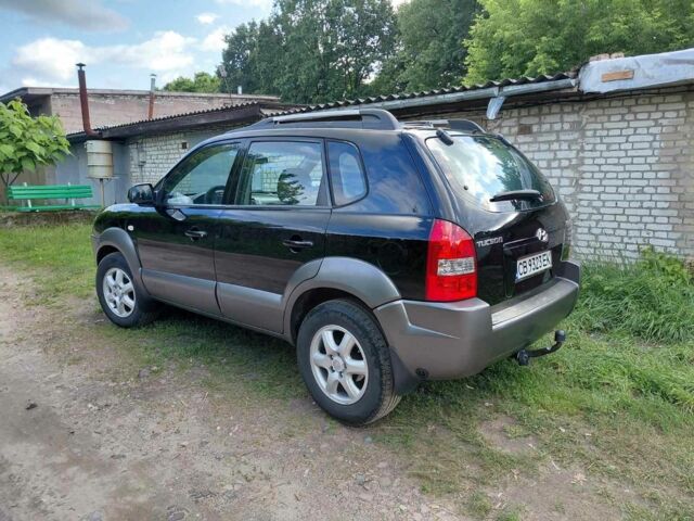 Черный Хендай Туксон, объемом двигателя 2 л и пробегом 238 тыс. км за 8200 $, фото 4 на Automoto.ua