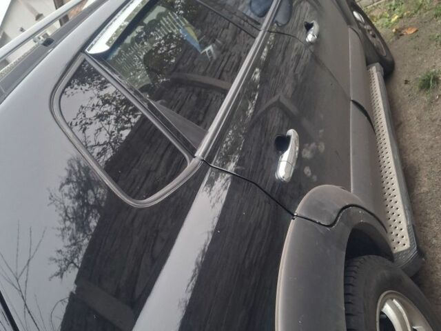 Черный Хендай Туксон, объемом двигателя 2 л и пробегом 224 тыс. км за 6800 $, фото 11 на Automoto.ua