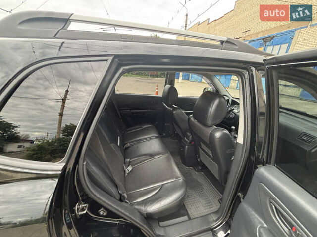 Черный Хендай Туксон, объемом двигателя 1.98 л и пробегом 215 тыс. км за 8600 $, фото 11 на Automoto.ua