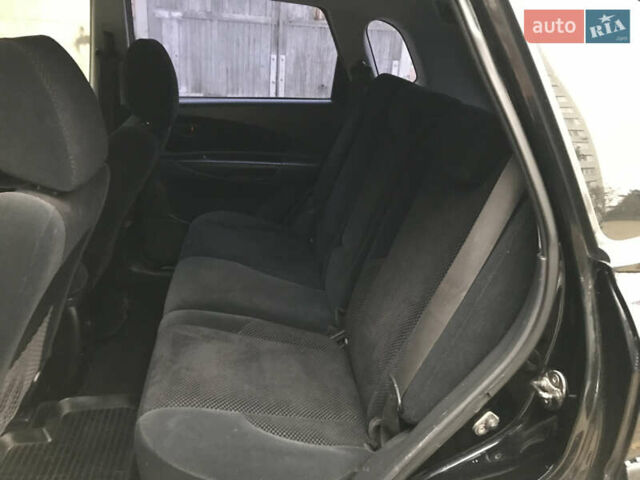 Черный Хендай Туксон, объемом двигателя 2 л и пробегом 261 тыс. км за 6500 $, фото 11 на Automoto.ua