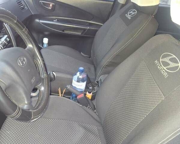 Черный Хендай Туксон, объемом двигателя 2 л и пробегом 224 тыс. км за 6800 $, фото 4 на Automoto.ua