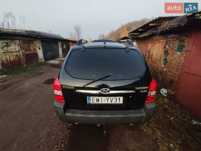 Черный Хендай Туксон, объемом двигателя 1.99 л и пробегом 370 тыс. км за 3300 $, фото 6 на Automoto.ua
