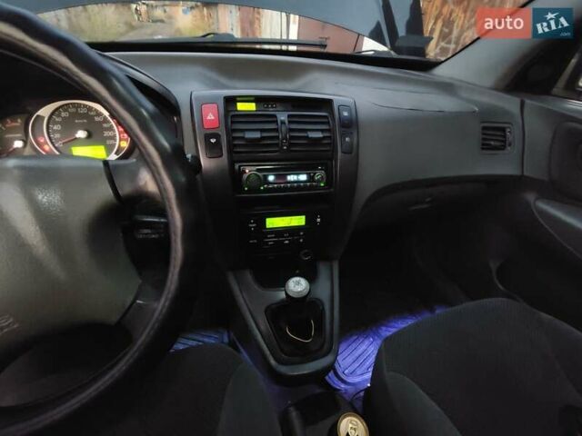 Черный Хендай Туксон, объемом двигателя 1.99 л и пробегом 370 тыс. км за 3300 $, фото 5 на Automoto.ua