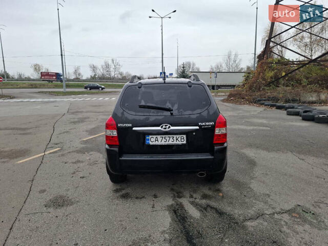 Черный Хендай Туксон, объемом двигателя 2 л и пробегом 170 тыс. км за 6999 $, фото 3 на Automoto.ua