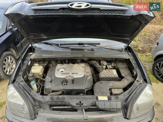 Черный Хендай Туксон, объемом двигателя 2 л и пробегом 211 тыс. км за 4444 $, фото 22 на Automoto.ua