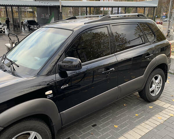 Черный Хендай Туксон, объемом двигателя 2 л и пробегом 219 тыс. км за 8400 $, фото 9 на Automoto.ua