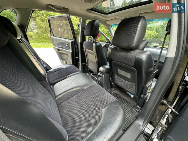 Черный Хендай Туксон, объемом двигателя 2 л и пробегом 210 тыс. км за 6600 $, фото 63 на Automoto.ua
