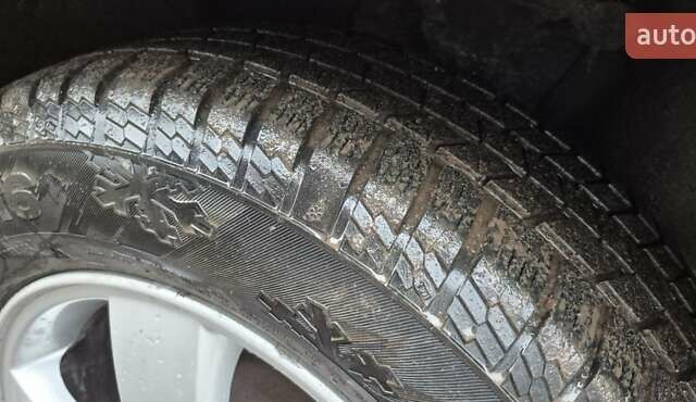 Черный Хендай Туксон, объемом двигателя 1.98 л и пробегом 230 тыс. км за 6390 $, фото 13 на Automoto.ua