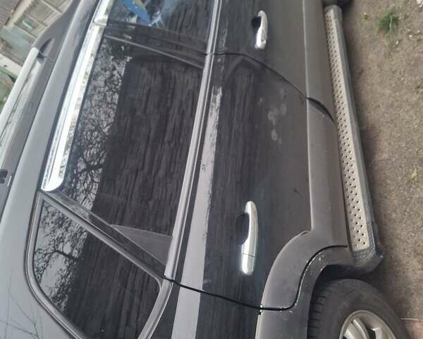 Черный Хендай Туксон, объемом двигателя 2 л и пробегом 224 тыс. км за 6800 $, фото 9 на Automoto.ua